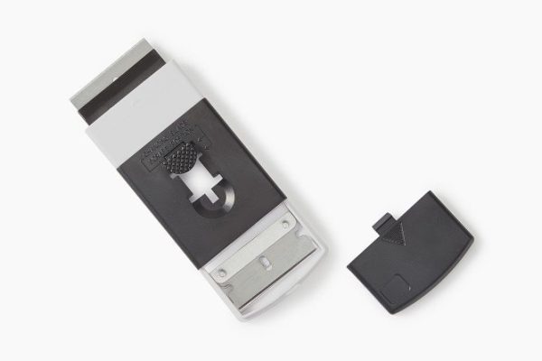 Scraper for glass ceramics with replaceable blades