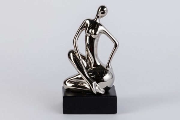 Figurine of a Woman sitting on her side 21 cm 11x21x9 cm